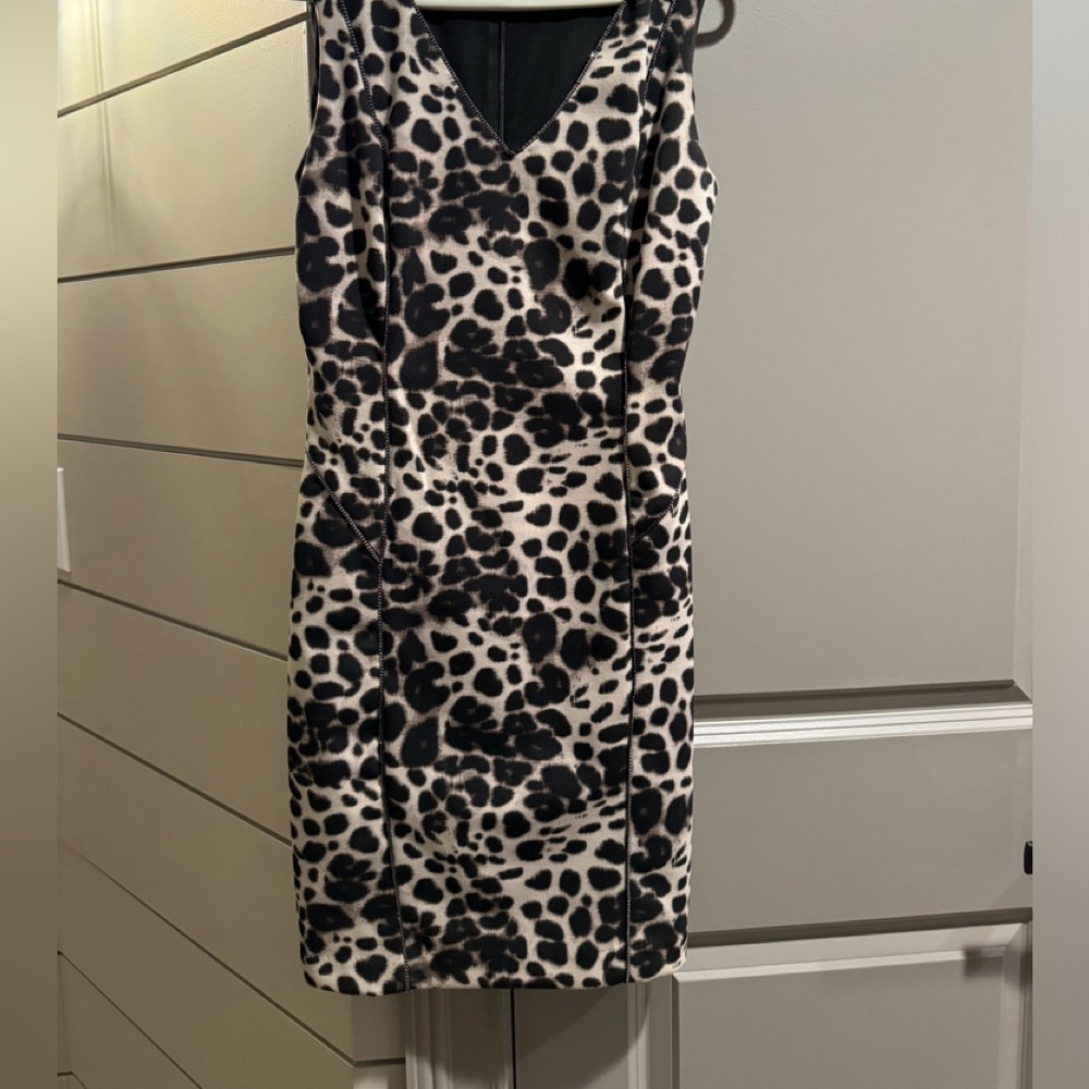 Lightly worn designer dress with sparkle edging!